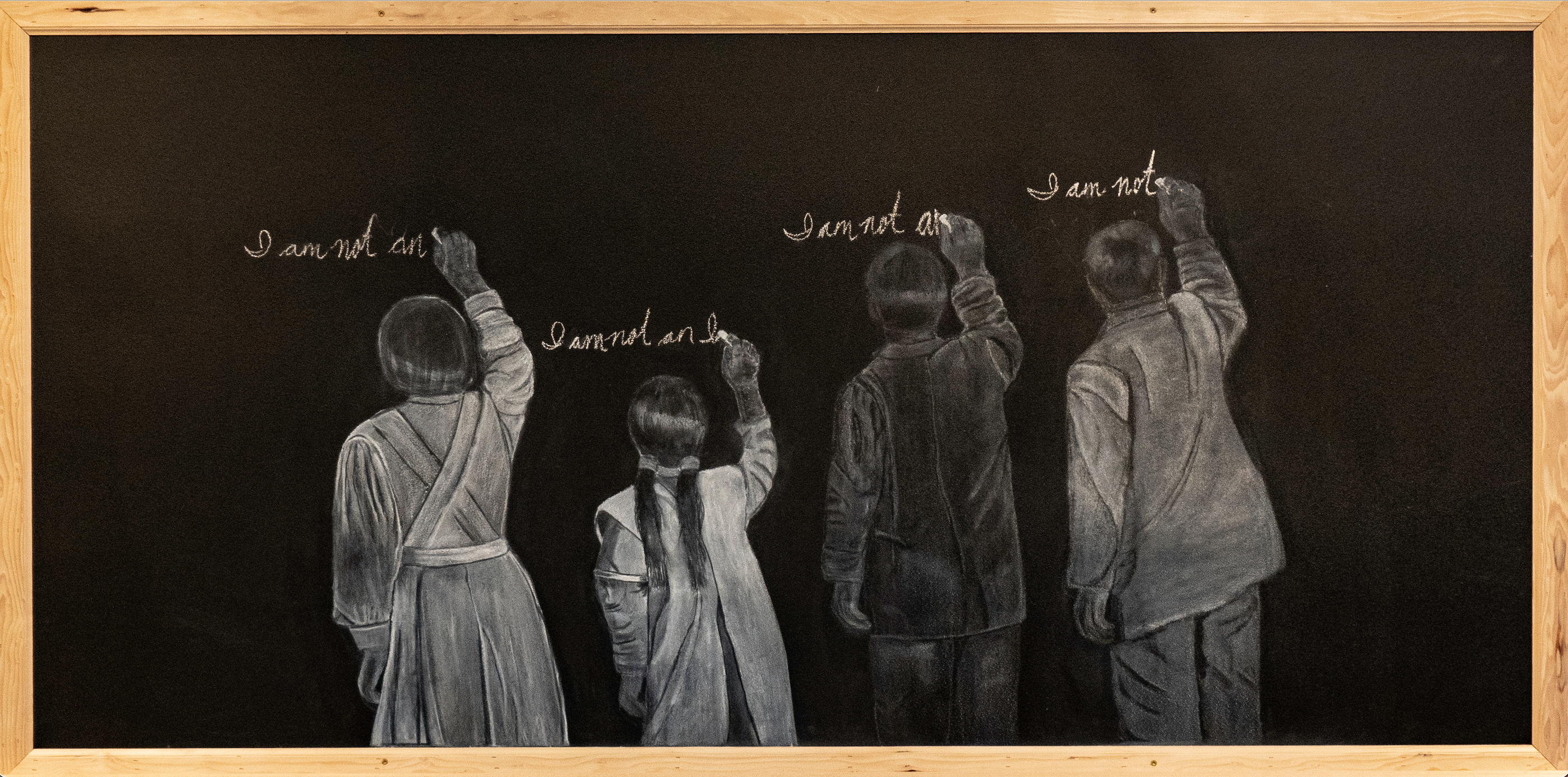 Drawing on a chalkboard of four children standing in front of a chalkboard and writing.