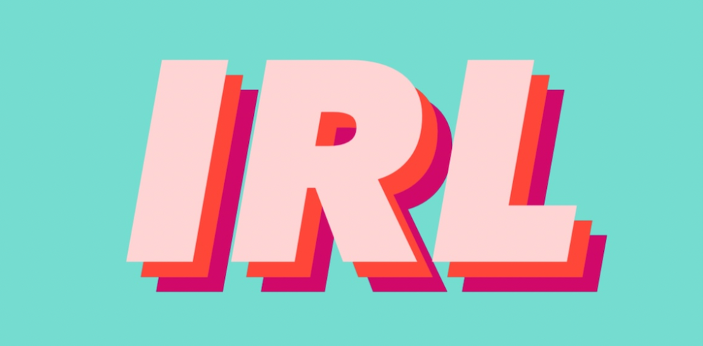 Turquoise background with peach and pink letters spelling out iRL.