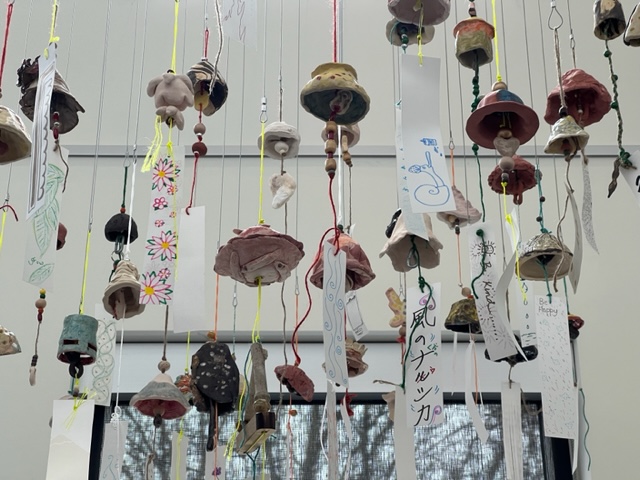 bells / furin hanging from the gallery cables 