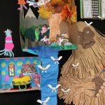 Detail of collage of landscape, city scape, and interior scenes, two-dimensional and three dimensional, installed on a black wall.