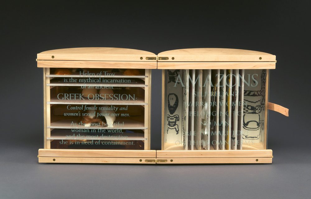 Hand crafted cylindrical box by Mark Burdon opened to expose internal structure withl etterpress printed handset type and polymer plates. Internal materials include: ink drawings, chicken egg shell, plaster, oil paint, tangerine skins, gold leaf, acrylic balls, and antique glass and aluminum slide mounts, ceramic, human hair, wood, sandblasted glass, and leather.