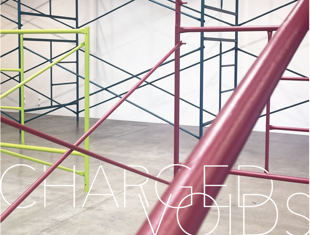 Green, turquoise and pink scaffolding with the words "Charged Voids".