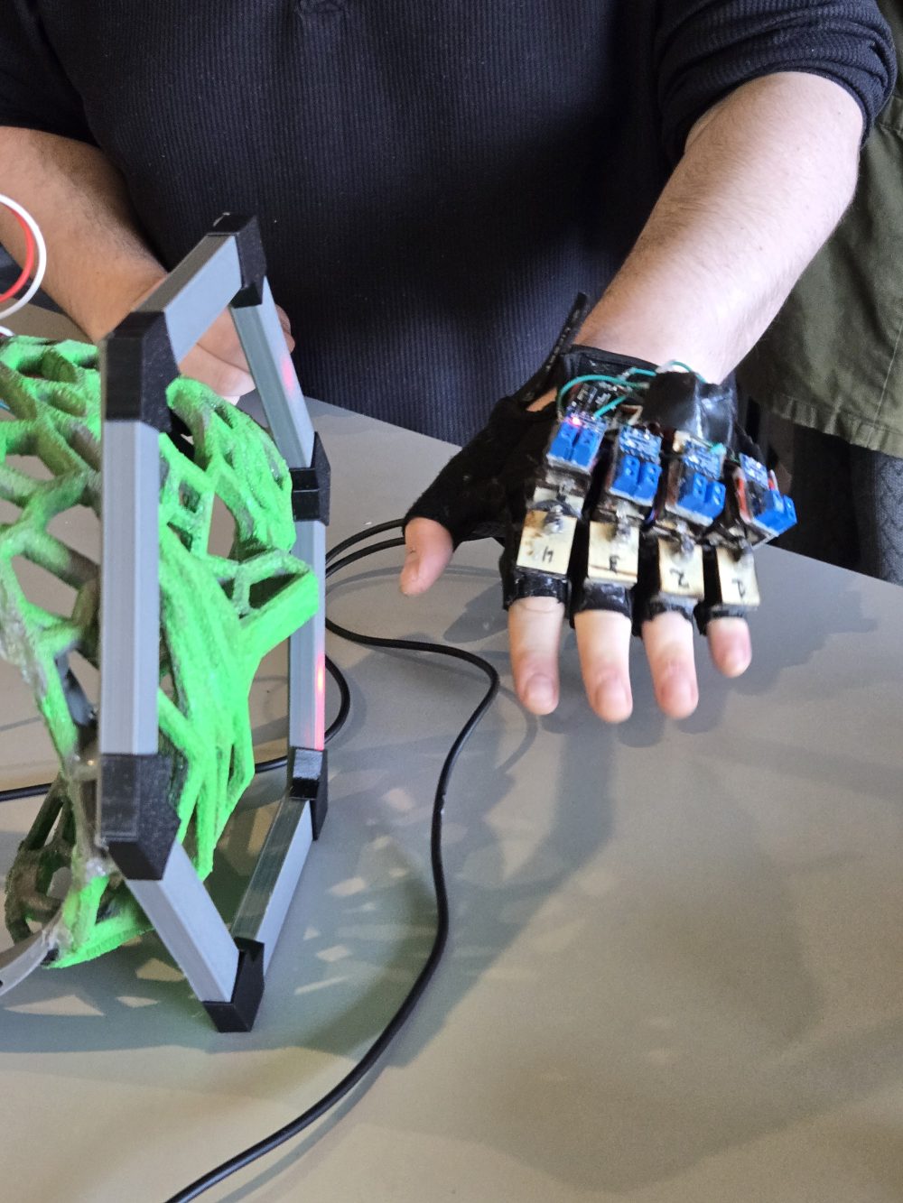 students examine technology designed for deaf and hard of hearing musicians