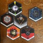 six tarot cards on a wooden desk