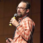 Ralf speaking at event