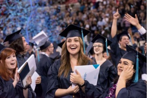 clapping smiling graduates