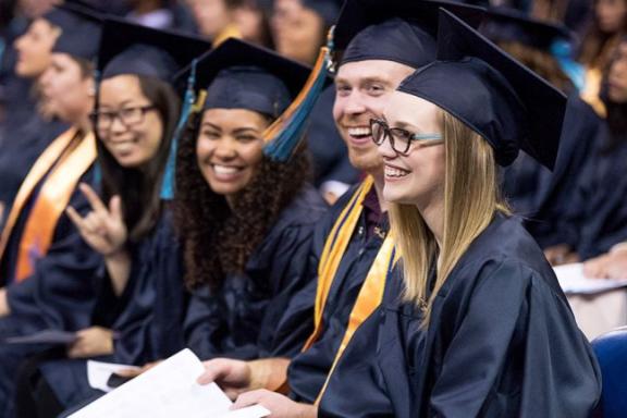 smiling grads rock on