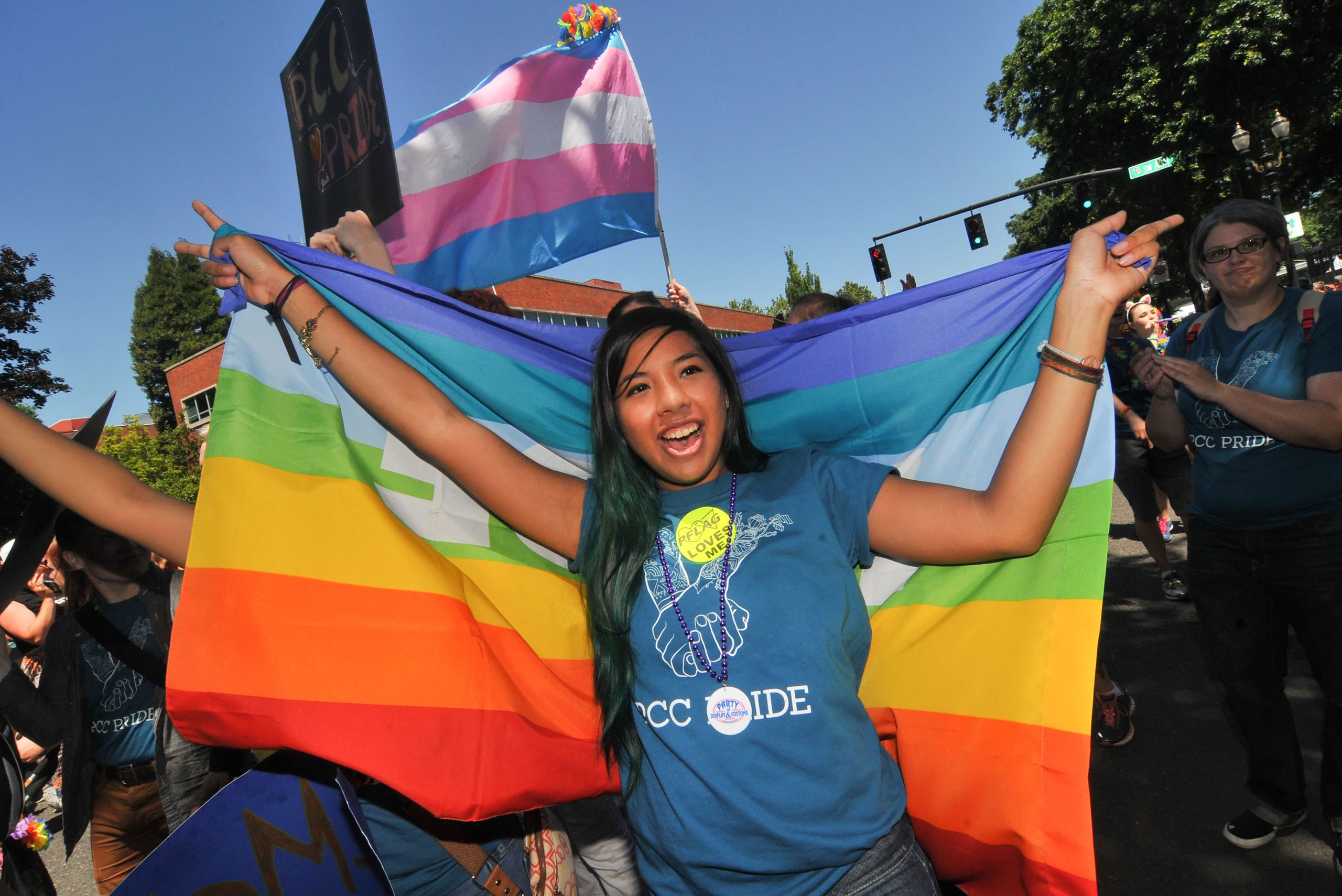 PCC Student holding a rainbow flag