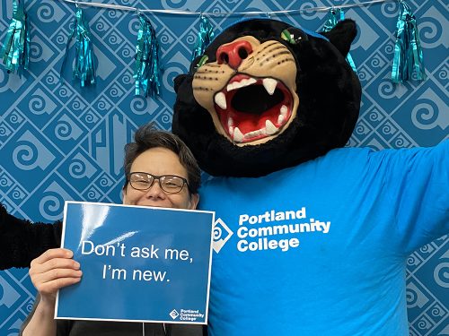 Poppie the Panther with a new employee