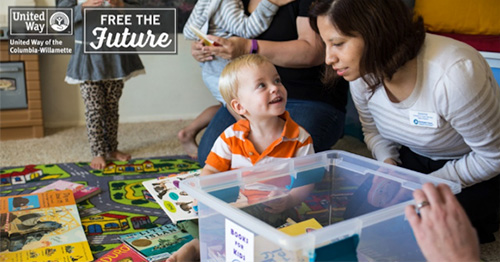 Woman working with toddler, with the words 'Free the Future' overlayed over the image