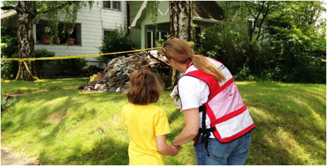 Red Cross helping a family with a damaged home