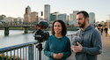 A man and woman recording video in Portland