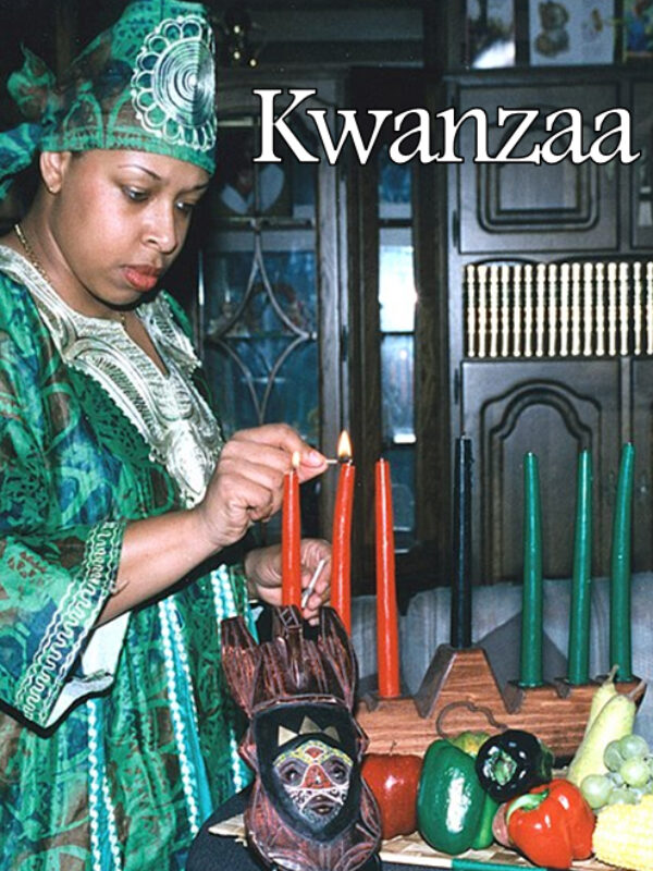 Kwanzaa celebration with woman lighting candles on table