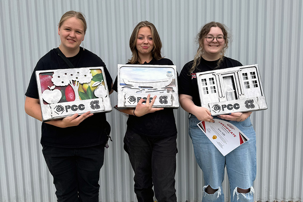 Students holding their projects