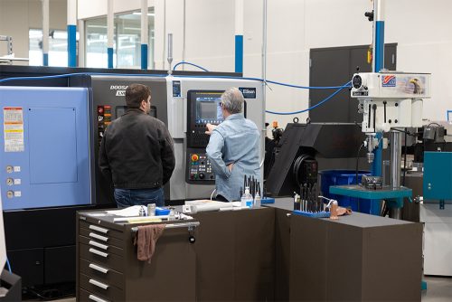 Student and instructor using machinery at the Columbia County Center