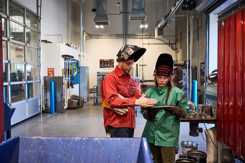 OMIC welding instructor and student