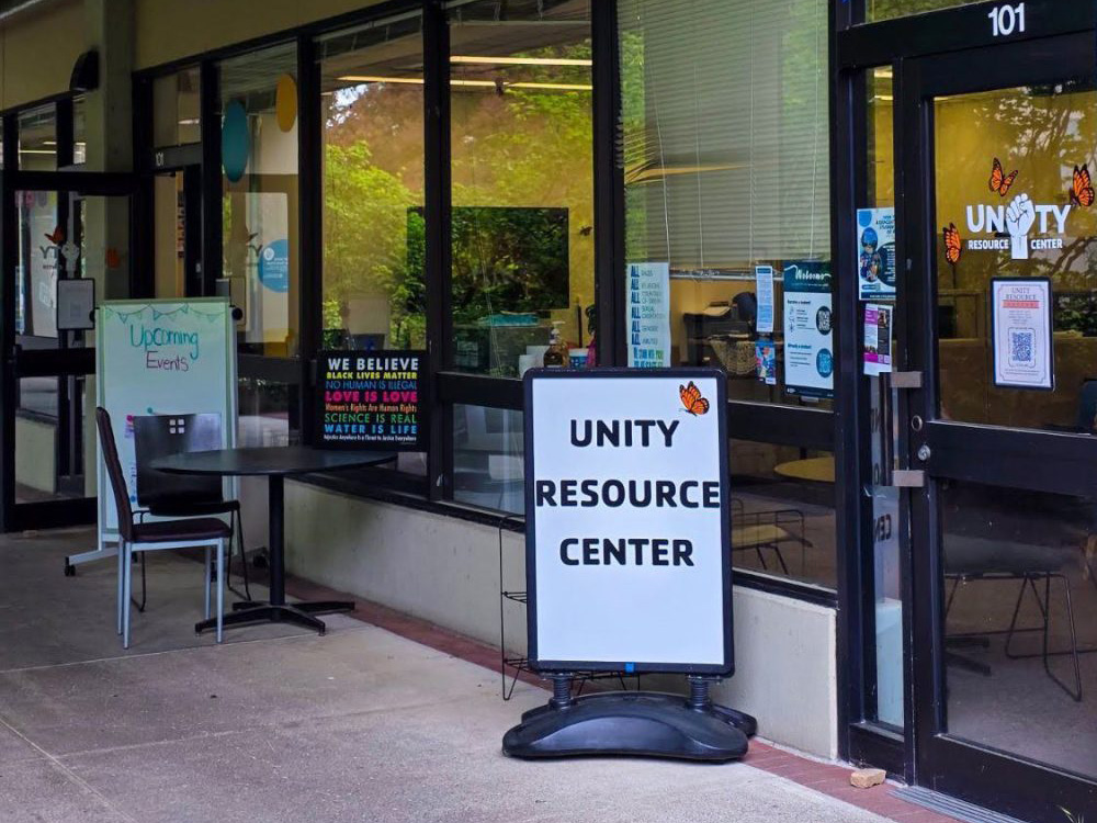Window lined front wall and entrance with sign for Unity Resource Center