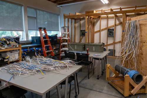 Electrical lab with wiring and house framing structure