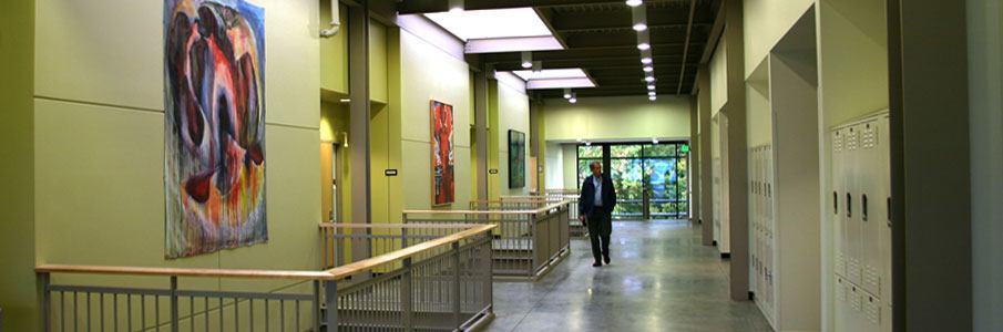 Indoor hallway with artwork and professor