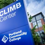 Climb Center sign with the building in the background