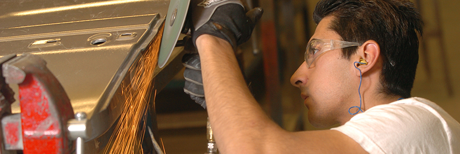 Auto Collision student working on a car