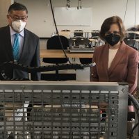 PCC President Mark Mitsui, left, and U.S. Rep. Suzanne Bonamici tour the semiconductor manufacturing lab at PCC's Willow Creek Center.