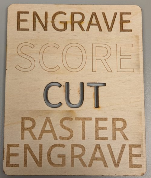 Example of engraving, scoring, cutting, and raster engraving using a laser cutter