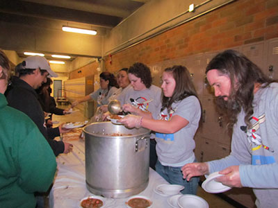 Students working in a soup kitchen