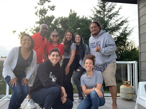 A picture of 7 members of the pcc district mc team outside on a patio in the sun.