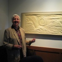 Her relief “Treasured Gifts” depicts the beauty of nature — sun, water and trees — and allows the sight impaired to experience by touch.