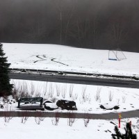The snow from the morning melted some before another round of snow (background) hit the campus midday on Tuesday, Jan. 17.