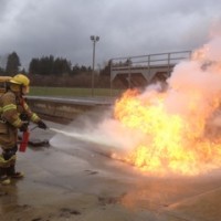 Trainees take part in a fire extinguisher drill at the Columbia County academy.