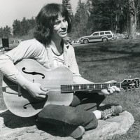 A student chills out on a Sylvania Campus lawn in the 1970s.
