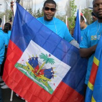 In April, Estanis, with his flag of Haiti, marched with fellow PCC students in the 82nd Avenue of Roses Parade.