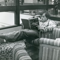 A student in the late 1970s reads in Building 3 at the Rock Creek Campus.