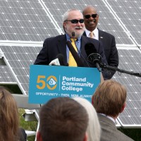 Rule speaks at last summer's solar array unveiling.