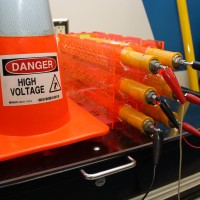 Individual batteries that are being recharged in the Sylvania Campus automotive shop.