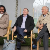 Speakers share a laugh.