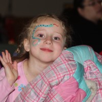 The results of face painting on a happy subject.