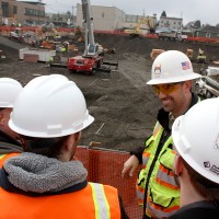Jacob McKay (background), the Cascade superintendent for Hoffman Construction, welcomed students from the Trades Preparation (APR 200) class to his construction site.