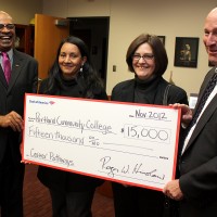 Barbie Cowan (middle right) joins, left to right, PCC President Preston Pulliams, fellow Career Pathways student Anna Coca and Bank of America President for Oregon and Southwest Washington Roger Hinshaw during a check donation ceremony for Career Pathways.