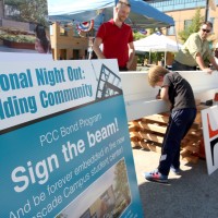 Thanks to the college’s Bond Program, representatives from Hoffman Construction and THA Architecture enticed attendees to sign their names to the beam, which will be one of the last things erected on the new student center building being constructed on the Cascade Campus.