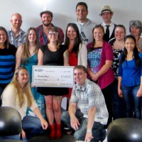 PCC students present the check to Friendly House.