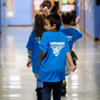 Kids wear Panther shirts provided by PCC.