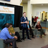 Southeast Center student leader Patrick Stupfel chats with the standing room only crowd in the Great Hall.