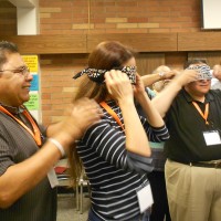 The cohort goes through a team building exercise.