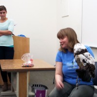 A Biology and Management of Zoo Animals Program instructor, shows off one of her feathered friends.