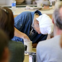 Shuichi Ogata demonstrates techniques in the Rock Creek ceramics studio.