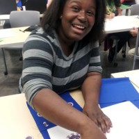 Kimberly Dessou works on circuitry during the Young Makers Club at the Southeast Campus.