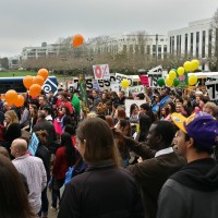 Rally Day at the Capitol Building with PCC's shuttle in the background.